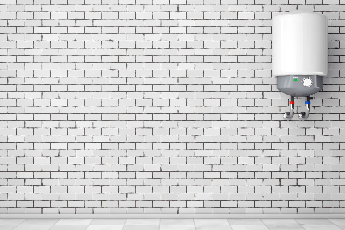 Residential water heater tank on a wall — a common source of slow hidden leaks in Tucson homes