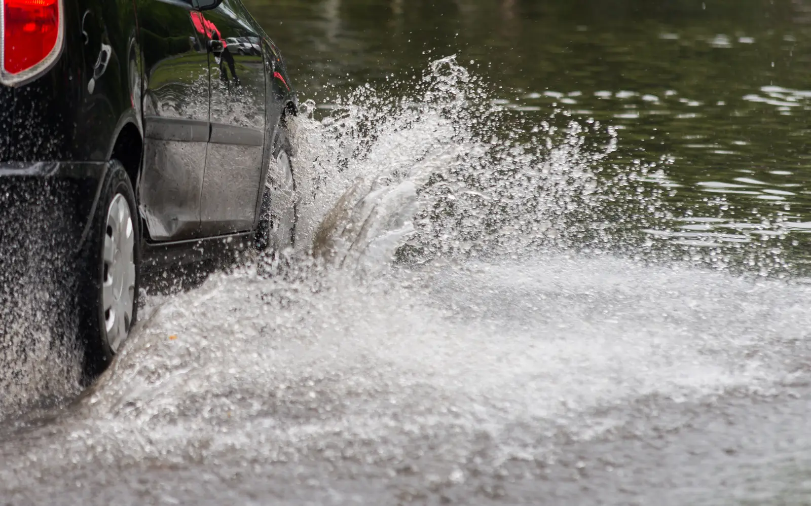 Vehicle stranded in standing floodwater after heavy monsoon rain in the Drexel Heights, AZ area