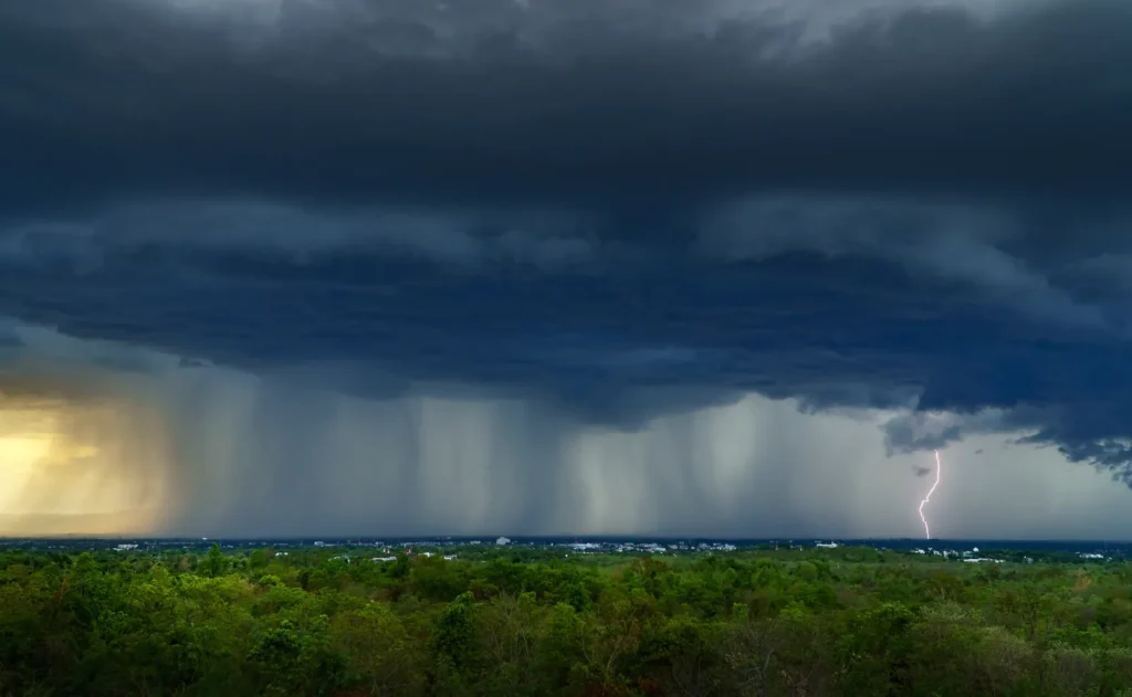A monsoon storm front advancing over desert foothills — cells like this send Peoria’s New River and Skunk Creek channels running within the hour